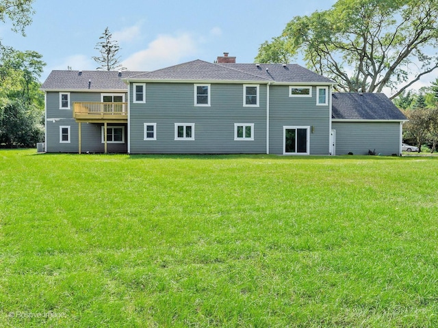 rear view of house with a lawn