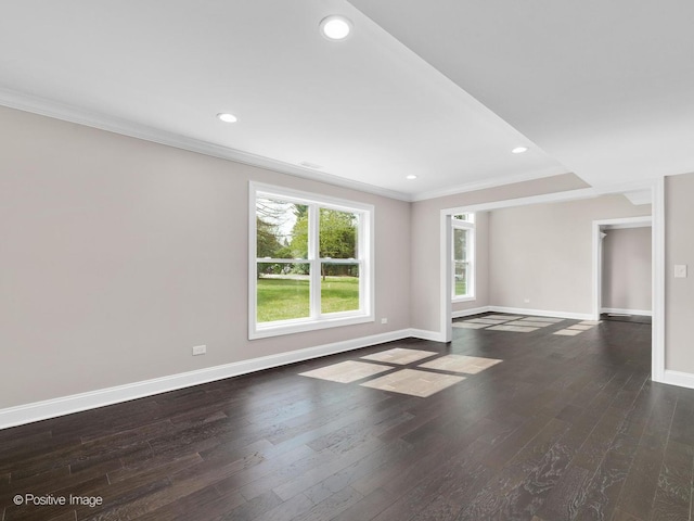 unfurnished living room with crown molding and dark wood-type flooring