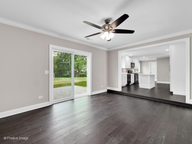 unfurnished living room with dark wood-type flooring, ornamental molding, and ceiling fan