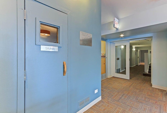 corridor featuring parquet floors