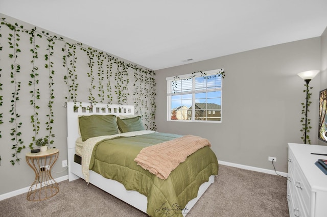 bedroom with light colored carpet