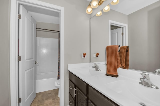 full bathroom with vanity, toilet, and shower / bath combo with shower curtain