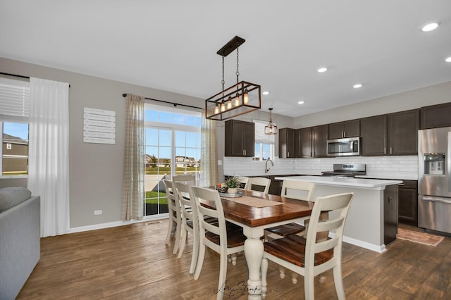 dining space with dark wood-type flooring