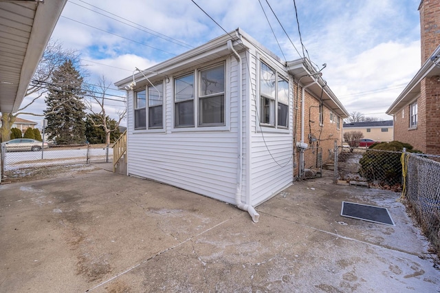 view of side of home with a patio area