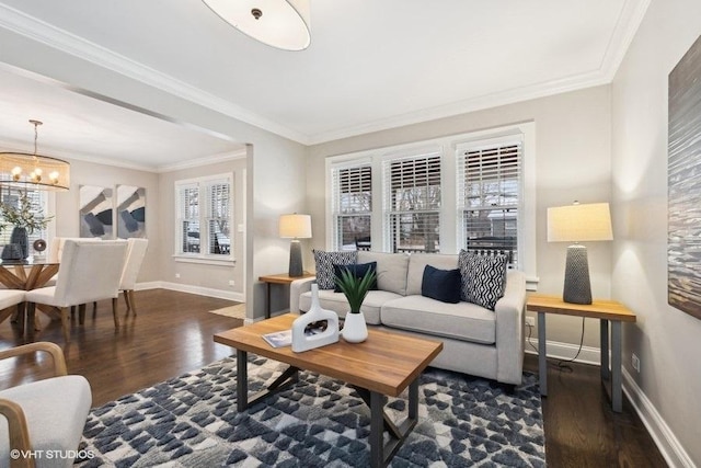 living room with ornamental molding, dark hardwood / wood-style floors, and a chandelier