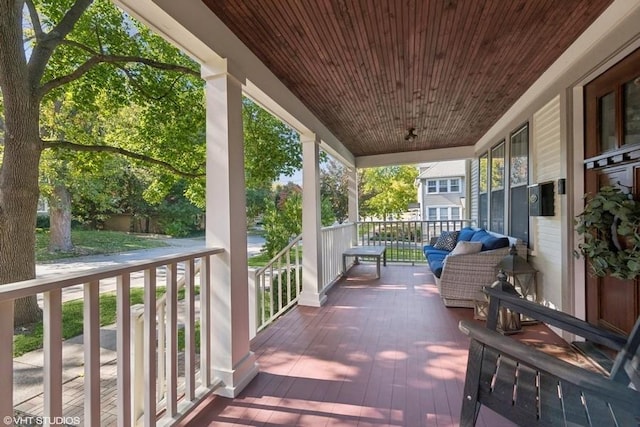 wooden deck featuring covered porch