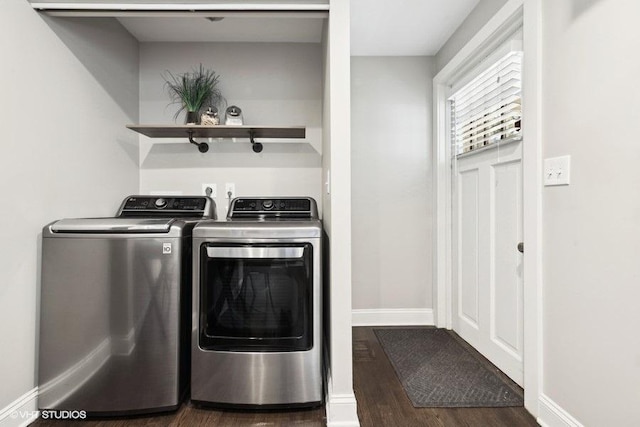 washroom featuring dark wood-type flooring and washing machine and clothes dryer