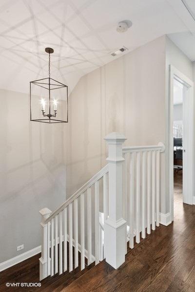 staircase featuring hardwood / wood-style floors