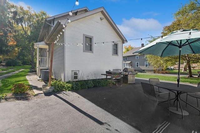 back of property featuring a patio area and central air condition unit