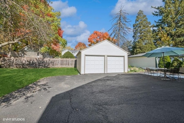 garage featuring a yard