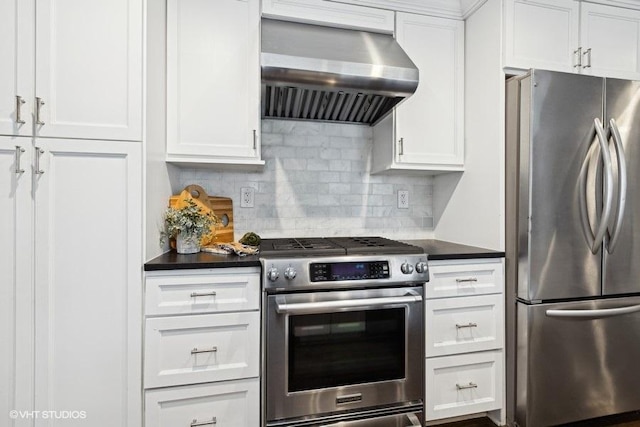 kitchen with white cabinetry, decorative backsplash, range hood, and appliances with stainless steel finishes