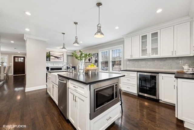 kitchen featuring white cabinetry, stainless steel appliances, wine cooler, dark hardwood / wood-style flooring, and decorative light fixtures