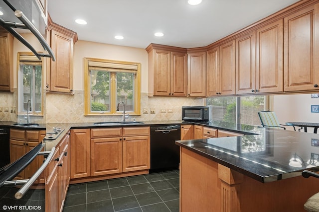 1247 Highpoint Ln, Northbrook, IL 60062 - kitchen featuring black appliances, a sink, dark tile patterned floors, a peninsula, and a kitchen bar