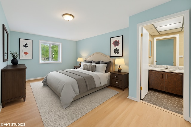 1247 Highpoint Ln, Northbrook, IL 60062 - bedroom with a sink, light wood-type flooring, and connected bathroom