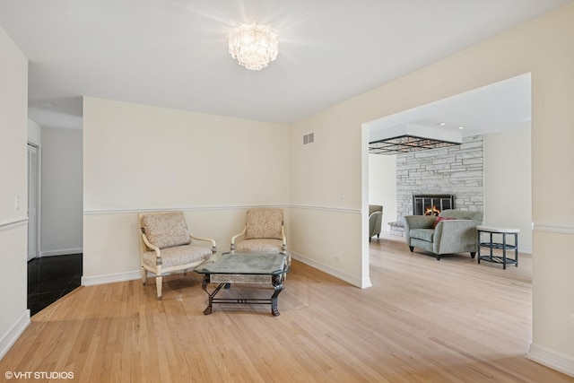 1247 Highpoint Ln, Northbrook, IL 60062 - living area featuring wood finished floors, baseboards, and a fireplace