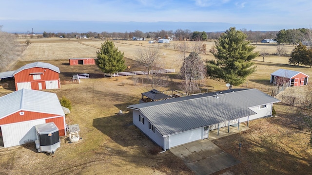 birds eye view of property featuring a rural view