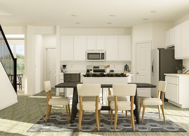 kitchen with white cabinetry and stainless steel electric range oven