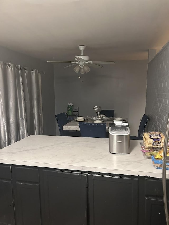 kitchen featuring ceiling fan