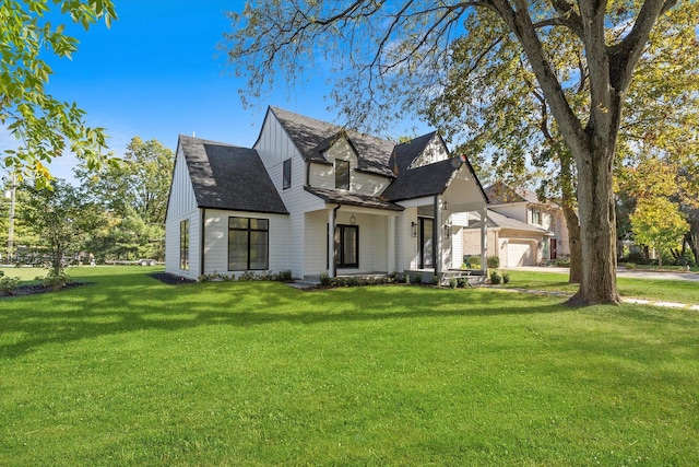 view of front of home featuring a garage and a front yard