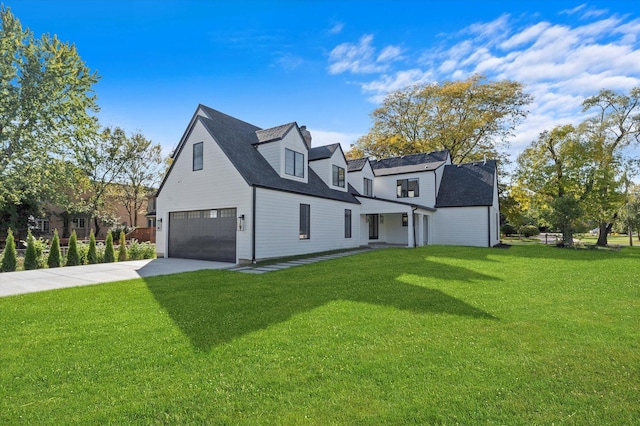 exterior space with a yard and a garage