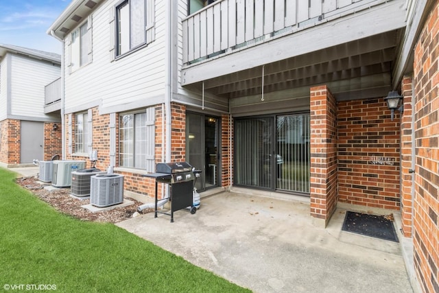 view of patio / terrace featuring a balcony, central AC, and grilling area