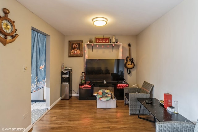 living room featuring water heater and wood-type flooring