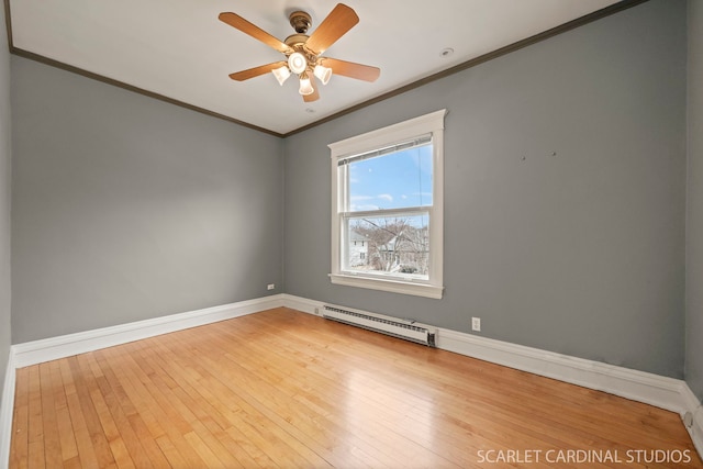 empty room featuring baseboard heating, ceiling fan, crown molding, and hardwood / wood-style floors