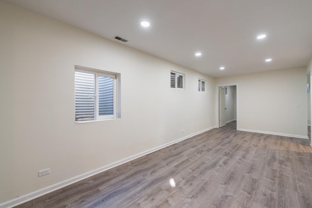 unfurnished room with light hardwood / wood-style floors