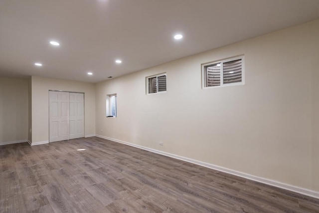 unfurnished bedroom featuring hardwood / wood-style flooring and a closet