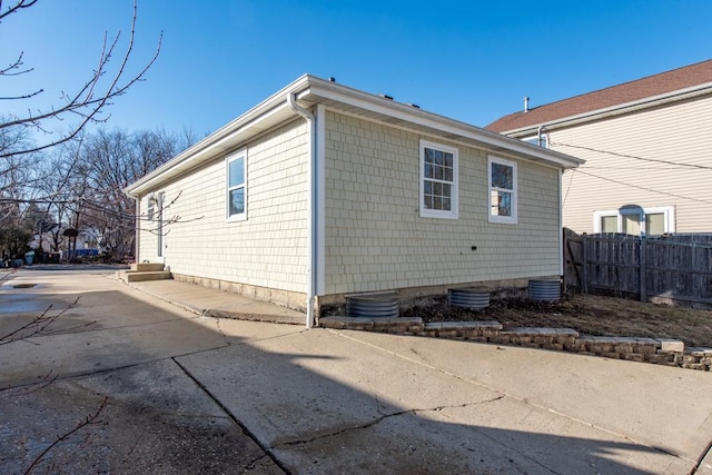 view of side of property featuring a patio area