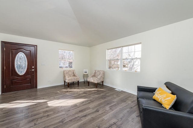 sitting room with lofted ceiling and hardwood / wood-style flooring