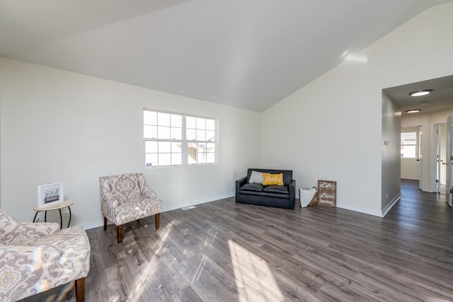 sitting room with vaulted ceiling and dark hardwood / wood-style floors