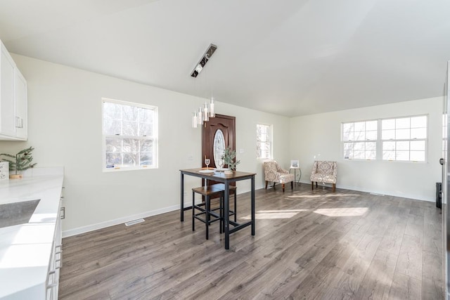 dining area with wood-type flooring