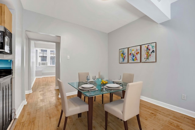 dining room with light hardwood / wood-style flooring