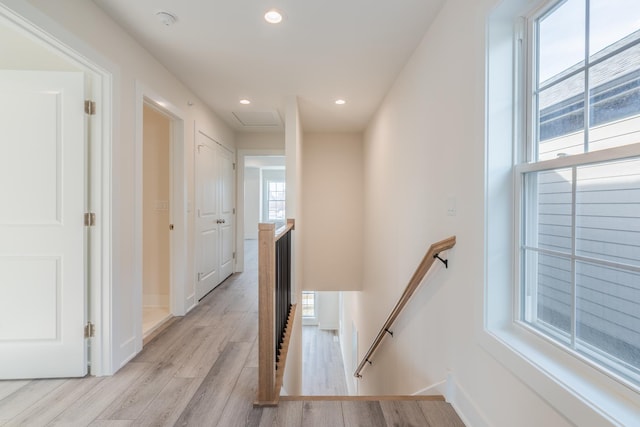 corridor with light wood-type flooring