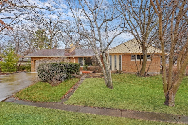 ranch-style house with a garage and a front yard