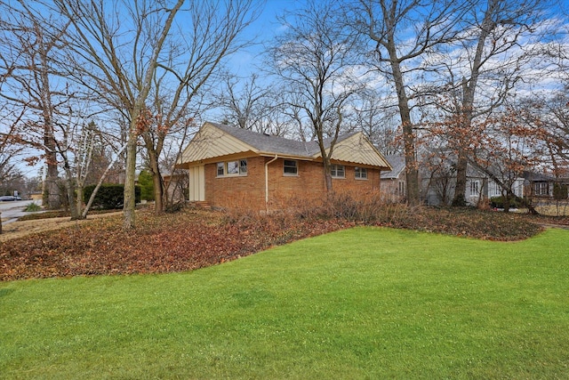 view of side of property with a yard