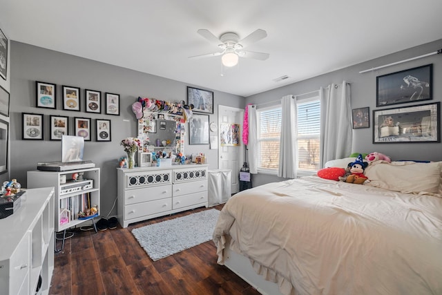 bedroom with ceiling fan and dark hardwood / wood-style floors