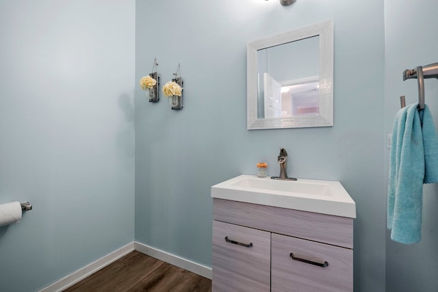 bathroom featuring vanity and hardwood / wood-style floors