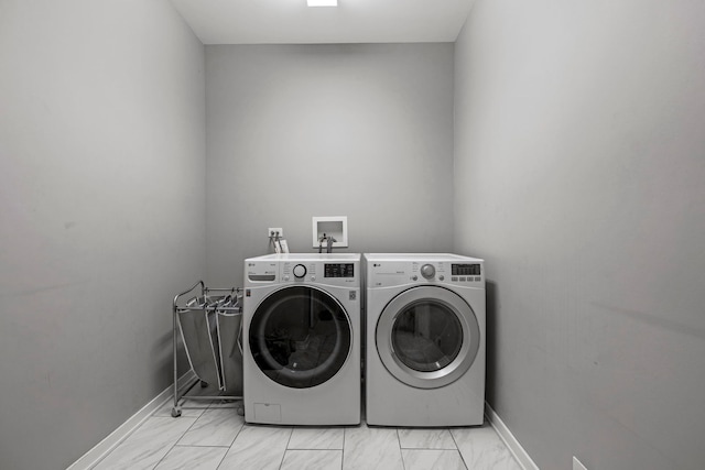 clothes washing area featuring washing machine and dryer