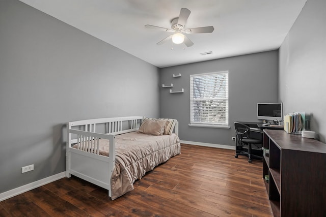 bedroom featuring dark hardwood / wood-style floors and ceiling fan