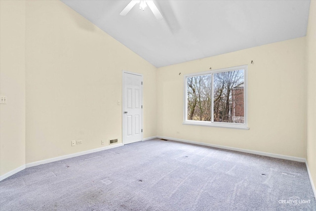 spare room featuring carpet flooring, visible vents, and baseboards