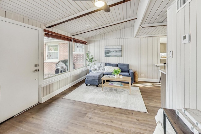 sunroom / solarium with lofted ceiling with beams and ceiling fan