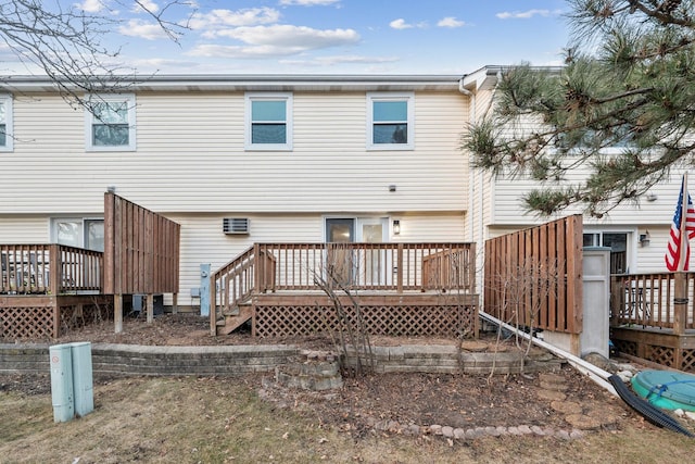 back of property with a wooden deck