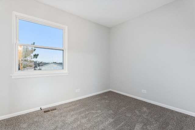 spare room featuring carpet flooring