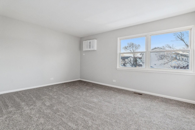 spare room featuring carpet flooring