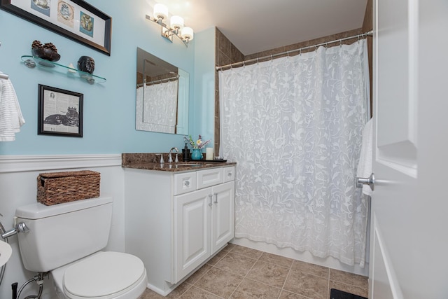 bathroom with vanity, toilet, and tile patterned flooring