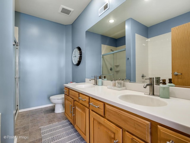 full bathroom featuring a stall shower, a sink, and visible vents