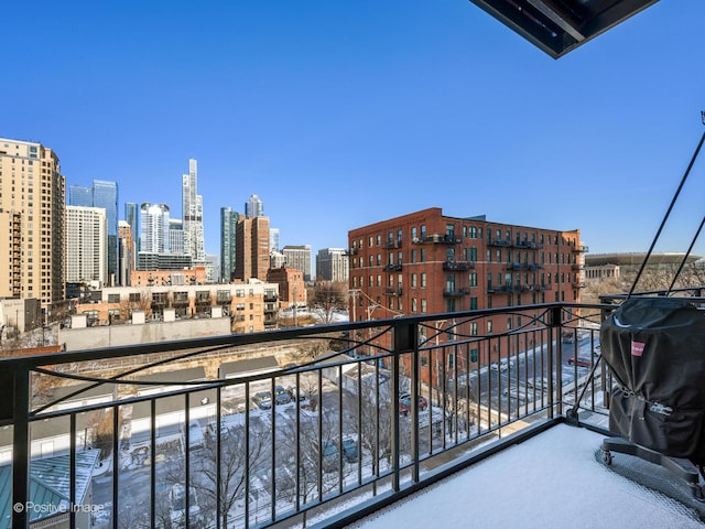 balcony with a grill and a city view