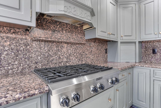 1801 Cobblefield Ct, Champaign, IL 61822 - kitchen featuring stainless steel gas stovetop, backsplash, custom range hood, and white cabinets